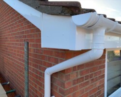 White UPVC fascia, soffit and guttering on a brick home in Gloucestershire
