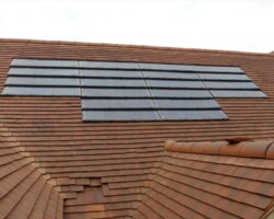 Solar panels installed on a red tiled roof in Gloucestershire