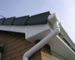 White UPVC fascia, soffit and downpipe fitted on a Gloucestershire home