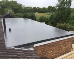 Dark EPDM flat roof on an extension overlooking fields in Gloucestershire