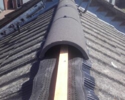 New dry ridge system fitted along a tiled roof ridge in Gloucestershire