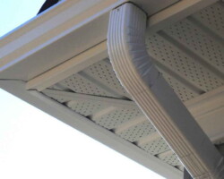Underside of white UPVC soffit with ventilation and guttering in Gloucestershire