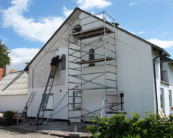 Smooth rendered exterior wall finished during building works in Gloucestershire