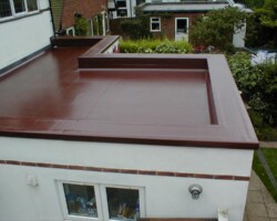 Maroon GRP fibreglass flat roof with parapet on a Gloucestershire extension